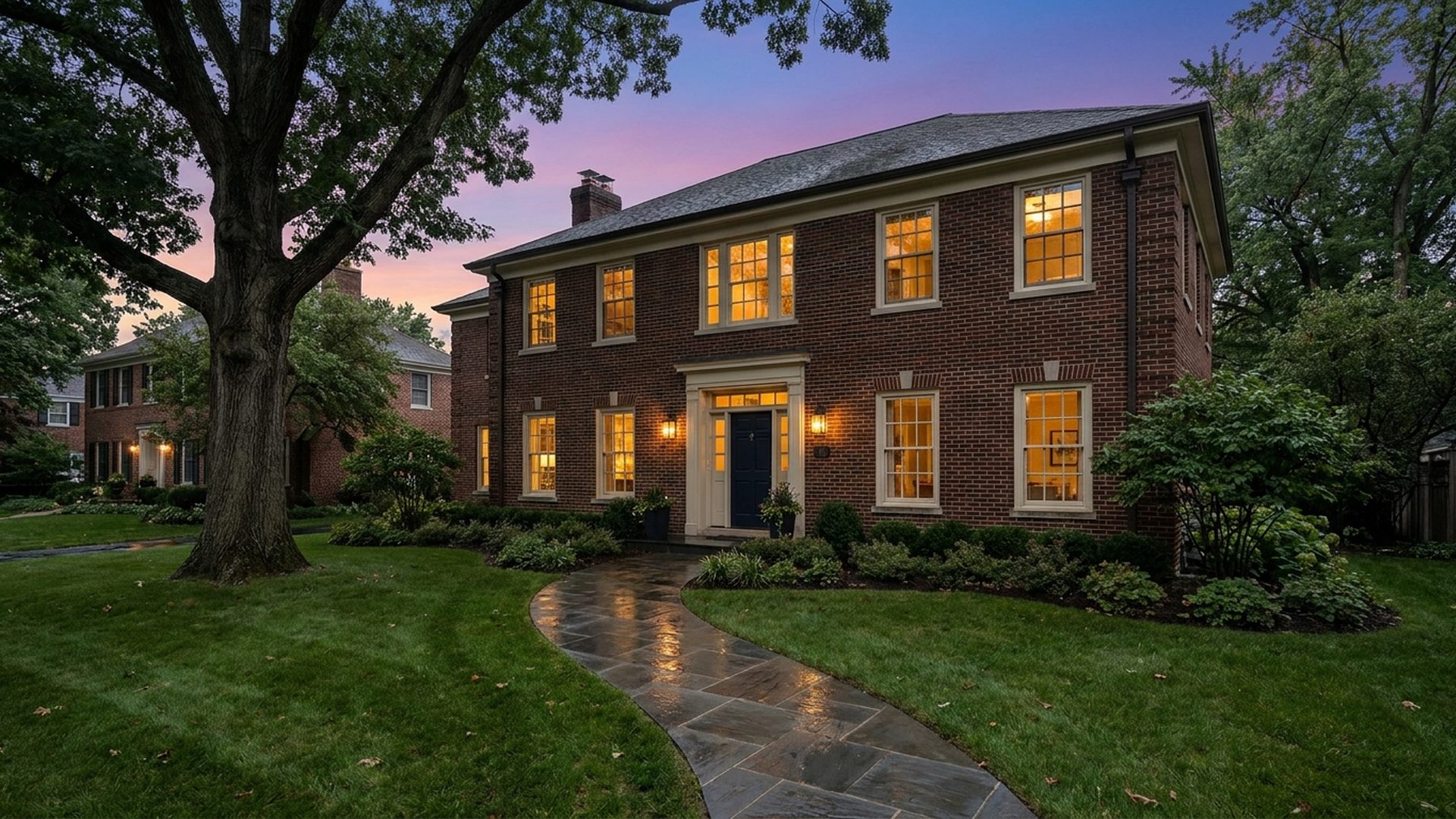A brick colonial home in the Northwest Suburbs at twilight